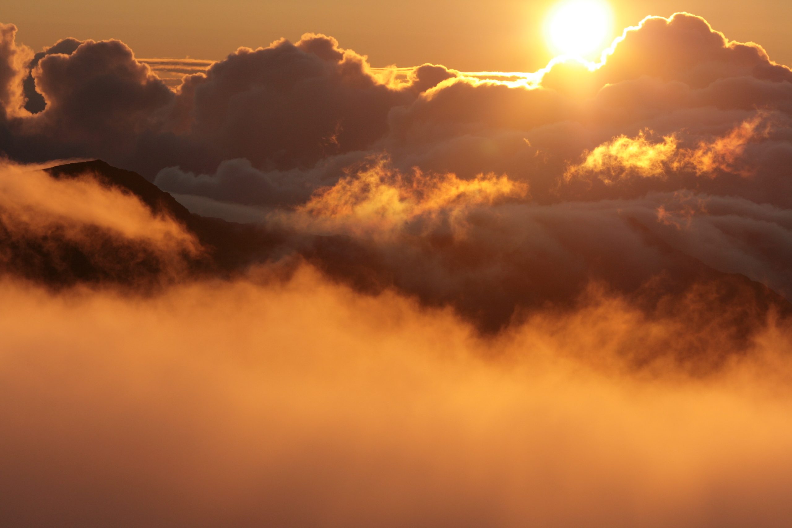 Sun setting above the clouds